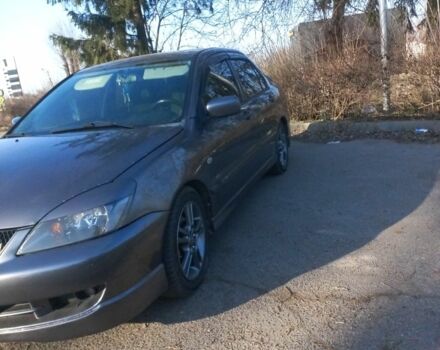 Серый Мицубиси Лансер, объемом двигателя 2 л и пробегом 180 тыс. км за 5000 $, фото 1 на Automoto.ua