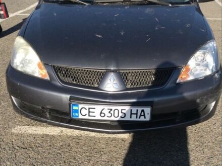 Серый Мицубиси Лансер, объемом двигателя 1.5 л и пробегом 269 тыс. км за 4200 $, фото 1 на Automoto.ua