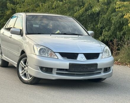 Серый Мицубиси Лансер, объемом двигателя 2 л и пробегом 185 тыс. км за 4600 $, фото 1 на Automoto.ua