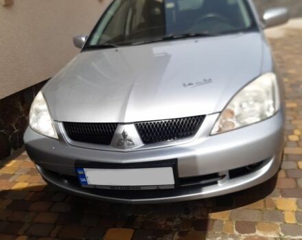 Серый Мицубиси Лансер, объемом двигателя 1.5 л и пробегом 176 тыс. км за 2850 $, фото 1 на Automoto.ua