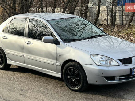 Сірий Міцубісі Lancer, об'ємом двигуна 1.58 л та пробігом 290 тис. км за 3750 $, фото 1 на Automoto.ua