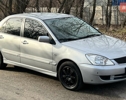 Серый Мицубиси Лансер, объемом двигателя 1.58 л и пробегом 290 тыс. км за 3750 $, фото 1 на Automoto.ua