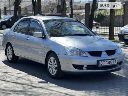 Сірий Міцубісі Lancer, об'ємом двигуна 1.58 л та пробігом 275 тис. км за 4299 $, фото 1 на Automoto.ua