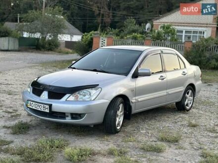 Серый Мицубиси Лансер, объемом двигателя 1.6 л и пробегом 197 тыс. км за 4200 $, фото 1 на Automoto.ua