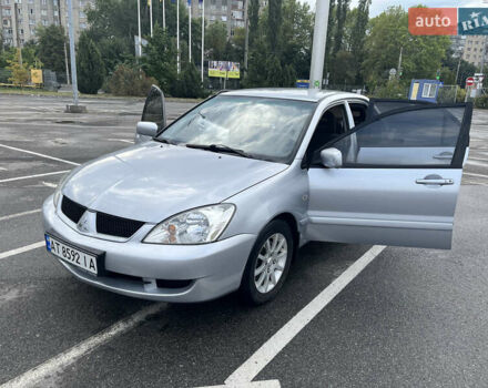 Серый Мицубиси Лансер, объемом двигателя 1.58 л и пробегом 232 тыс. км за 4900 $, фото 1 на Automoto.ua