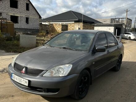 Серый Мицубиси Лансер, объемом двигателя 1.6 л и пробегом 200 тыс. км за 2300 $, фото 1 на Automoto.ua