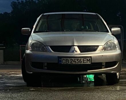 Сірий Міцубісі Lancer, об'ємом двигуна 1.6 л та пробігом 256 тис. км за 3496 $, фото 1 на Automoto.ua