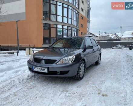 Серый Мицубиси Лансер, объемом двигателя 1.58 л и пробегом 170 тыс. км за 3999 $, фото 1 на Automoto.ua