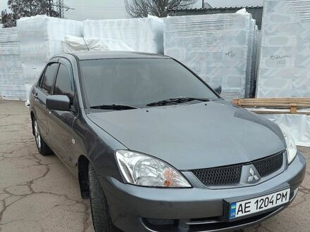 Серый Мицубиси Лансер, объемом двигателя 1.6 л и пробегом 220 тыс. км за 4200 $, фото 1 на Automoto.ua