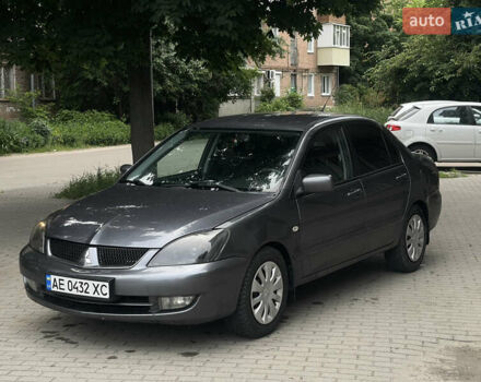 Серый Мицубиси Лансер, объемом двигателя 1.58 л и пробегом 309 тыс. км за 3950 $, фото 1 на Automoto.ua