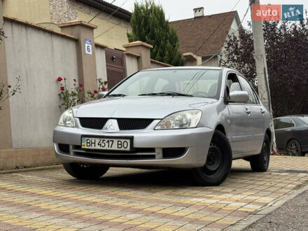 Серый Мицубиси Лансер, объемом двигателя 1.6 л и пробегом 221 тыс. км за 3650 $, фото 1 на Automoto.ua