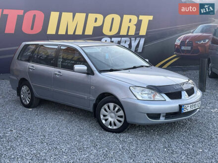 Серый Мицубиси Лансер, объемом двигателя 1.6 л и пробегом 278 тыс. км за 3900 $, фото 1 на Automoto.ua