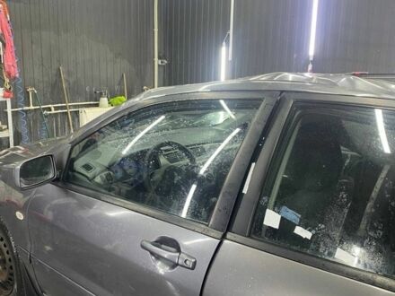 Серый Мицубиси Лансер, объемом двигателя 1.6 л и пробегом 100 тыс. км за 2500 $, фото 1 на Automoto.ua