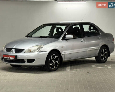 Серый Мицубиси Лансер, объемом двигателя 1.6 л и пробегом 155 тыс. км за 3999 $, фото 1 на Automoto.ua