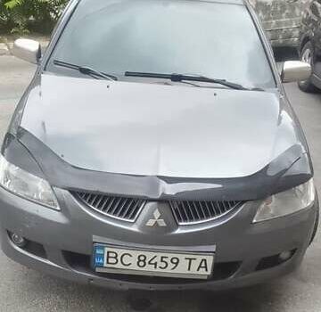 Серый Мицубиси Лансер, объемом двигателя 1.58 л и пробегом 323 тыс. км за 3300 $, фото 1 на Automoto.ua