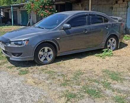 Сірий Міцубісі Lancer, об'ємом двигуна 2 л та пробігом 77 тис. км за 9800 $, фото 1 на Automoto.ua