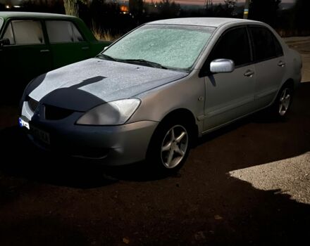 Серый Мицубиси Лансер, объемом двигателя 1.6 л и пробегом 340 тыс. км за 3000 $, фото 1 на Automoto.ua