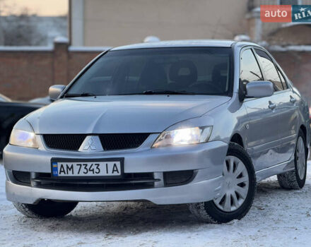 Серый Мицубиси Лансер, объемом двигателя 1.58 л и пробегом 255 тыс. км за 4050 $, фото 1 на Automoto.ua