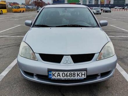 Серый Мицубиси Лансер, объемом двигателя 1.58 л и пробегом 216 тыс. км за 4700 $, фото 1 на Automoto.ua