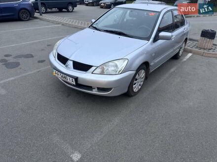 Серый Мицубиси Лансер, объемом двигателя 1.58 л и пробегом 330 тыс. км за 3500 $, фото 1 на Automoto.ua