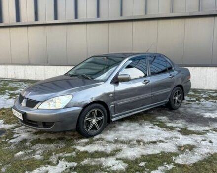 Серый Мицубиси Лансер, объемом двигателя 1.58 л и пробегом 320 тыс. км за 3300 $, фото 1 на Automoto.ua