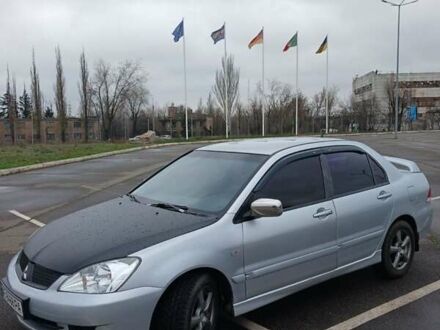 Серый Мицубиси Лансер, объемом двигателя 1.6 л и пробегом 225 тыс. км за 5200 $, фото 1 на Automoto.ua