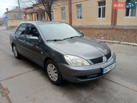 Серый Мицубиси Лансер, объемом двигателя 1.58 л и пробегом 205 тыс. км за 3300 $, фото 1 на Automoto.ua