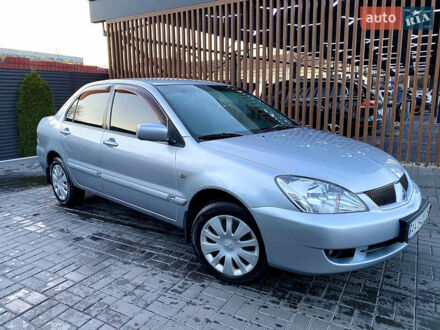 Серый Мицубиси Лансер, объемом двигателя 1.6 л и пробегом 203 тыс. км за 5200 $, фото 1 на Automoto.ua