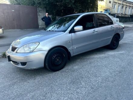 Сірий Міцубісі Lancer, об'ємом двигуна 1.6 л та пробігом 198 тис. км за 3198 $, фото 1 на Automoto.ua