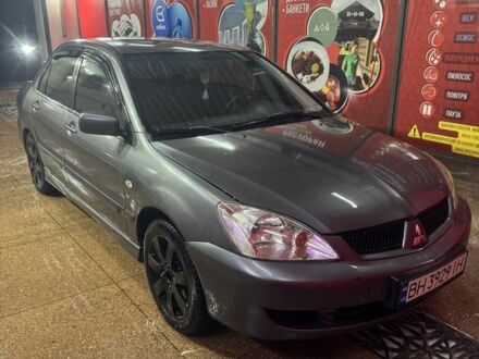 Серый Мицубиси Лансер, объемом двигателя 1.6 л и пробегом 268 тыс. км за 4600 $, фото 1 на Automoto.ua