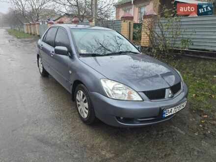 Сірий Міцубісі Lancer, об'ємом двигуна 1.58 л та пробігом 298 тис. км за 3400 $, фото 1 на Automoto.ua