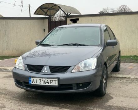 Серый Мицубиси Лансер, объемом двигателя 1.6 л и пробегом 180 тыс. км за 4700 $, фото 1 на Automoto.ua
