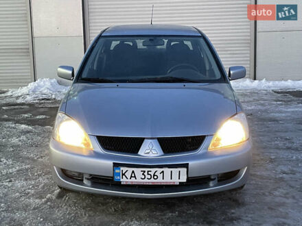 Серый Мицубиси Лансер, объемом двигателя 1.59 л и пробегом 313 тыс. км за 4000 $, фото 1 на Automoto.ua