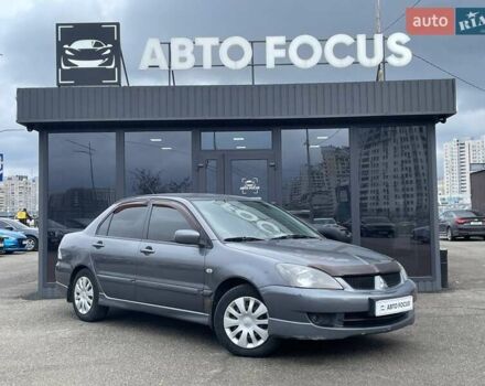 Сірий Міцубісі Lancer, об'ємом двигуна 1.58 л та пробігом 146 тис. км за 5490 $, фото 1 на Automoto.ua