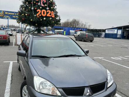 Серый Мицубиси Лансер, объемом двигателя 1.58 л и пробегом 183 тыс. км за 3800 $, фото 1 на Automoto.ua