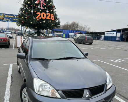 Серый Мицубиси Лансер, объемом двигателя 1.58 л и пробегом 183 тыс. км за 3800 $, фото 1 на Automoto.ua