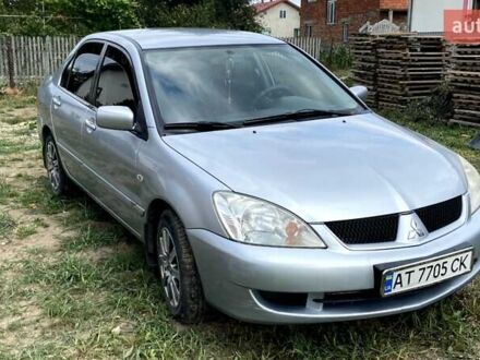 Сірий Міцубісі Lancer, об'ємом двигуна 1.58 л та пробігом 264 тис. км за 3550 $, фото 1 на Automoto.ua