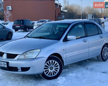 Серый Мицубиси Лансер, объемом двигателя 1.6 л и пробегом 204 тыс. км за 3899 $, фото 1 на Automoto.ua