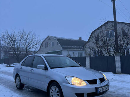 Сірий Міцубісі Lancer, об'ємом двигуна 1.58 л та пробігом 320 тис. км за 4199 $, фото 1 на Automoto.ua