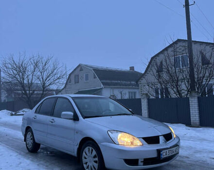 Серый Мицубиси Лансер, объемом двигателя 1.58 л и пробегом 320 тыс. км за 4199 $, фото 1 на Automoto.ua