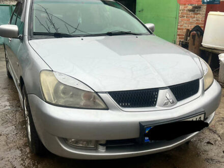 Сірий Міцубісі Lancer, об'ємом двигуна 1.6 л та пробігом 282 тис. км за 4699 $, фото 1 на Automoto.ua
