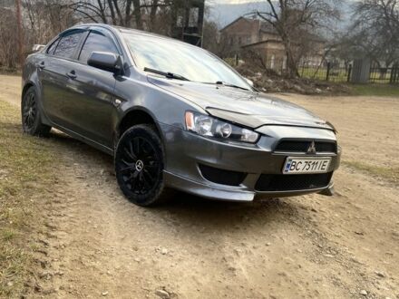 Серый Мицубиси Лансер, объемом двигателя 2 л и пробегом 220 тыс. км за 5750 $, фото 1 на Automoto.ua