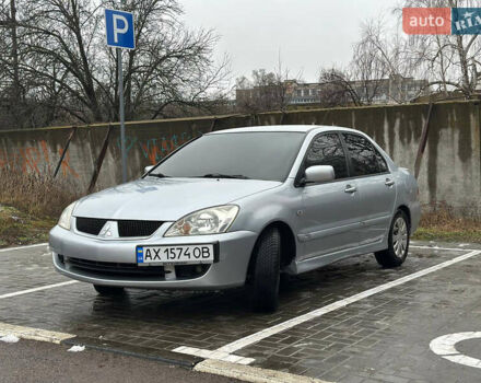 Серый Мицубиси Лансер, объемом двигателя 1.6 л и пробегом 165 тыс. км за 4000 $, фото 1 на Automoto.ua