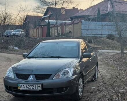 Серый Мицубиси Лансер, объемом двигателя 1.6 л и пробегом 129 тыс. км за 3500 $, фото 1 на Automoto.ua