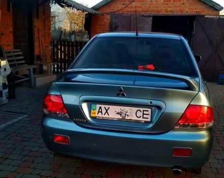 Серый Мицубиси Лансер, объемом двигателя 1.4 л и пробегом 200 тыс. км за 5200 $, фото 1 на Automoto.ua
