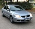 Сірий Міцубісі Lancer, об'ємом двигуна 1.6 л та пробігом 180 тис. км за 7000 $, фото 1 на Automoto.ua