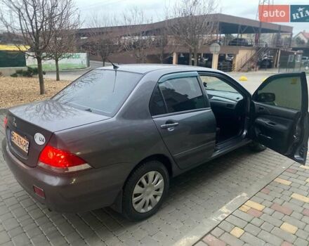 Серый Мицубиси Лансер, объемом двигателя 1.6 л и пробегом 245 тыс. км за 3800 $, фото 1 на Automoto.ua