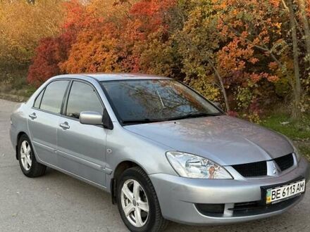 Серый Мицубиси Лансер, объемом двигателя 1.58 л и пробегом 145 тыс. км за 4800 $, фото 1 на Automoto.ua