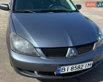 Серый Мицубиси Лансер, объемом двигателя 1.58 л и пробегом 516 тыс. км за 3800 $, фото 1 на Automoto.ua