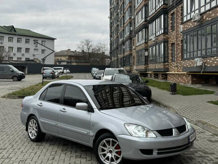 Серый Мицубиси Лансер, объемом двигателя 1.6 л и пробегом 269 тыс. км за 3999 $, фото 1 на Automoto.ua